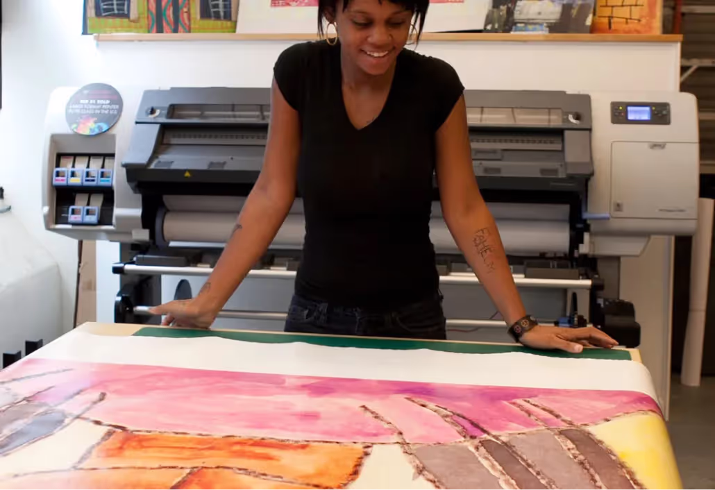 A woman standing in front of a large painting